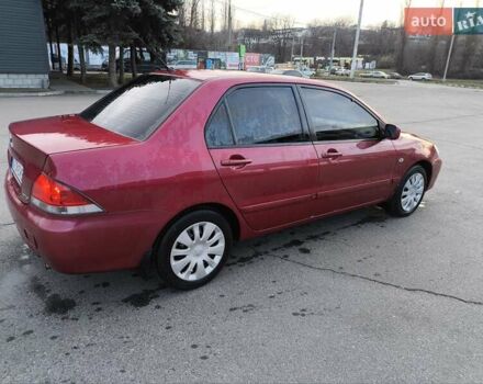 Червоний Міцубісі Lancer, об'ємом двигуна 1.58 л та пробігом 140 тис. км за 6000 $, фото 5 на Automoto.ua