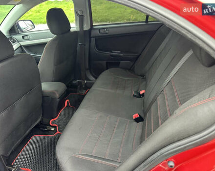 Червоний Міцубісі Lancer, об'ємом двигуна 2 л та пробігом 366 тис. км за 6500 $, фото 9 на Automoto.ua