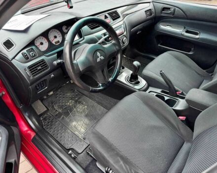 Красный Мицубиси Лансер, объемом двигателя 1.6 л и пробегом 215 тыс. км за 4500 $, фото 12 на Automoto.ua