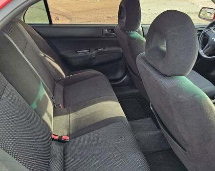 Червоний Міцубісі Lancer, об'ємом двигуна 1.6 л та пробігом 220 тис. км за 5800 $, фото 12 на Automoto.ua