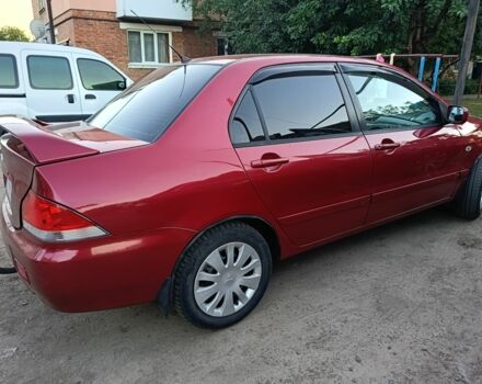 Червоний Міцубісі Lancer, об'ємом двигуна 1.6 л та пробігом 227 тис. км за 5300 $, фото 3 на Automoto.ua