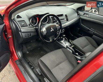 Красный Мицубиси Лансер, объемом двигателя 2 л и пробегом 330 тыс. км за 5250 $, фото 16 на Automoto.ua