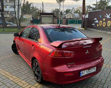 Красный Мицубиси Лансер, объемом двигателя 2 л и пробегом 143 тыс. км за 5200 $, фото 11 на Automoto.ua
