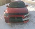 Красный Мицубиси Лансер, объемом двигателя 2 л и пробегом 218 тыс. км за 7500 $, фото 1 на Automoto.ua
