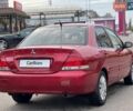 Червоний Міцубісі Lancer, об'ємом двигуна 1.58 л та пробігом 223 тис. км за 6400 $, фото 9 на Automoto.ua