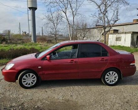 Червоний Міцубісі Lancer, об'ємом двигуна 1.6 л та пробігом 220 тис. км за 5800 $, фото 6 на Automoto.ua