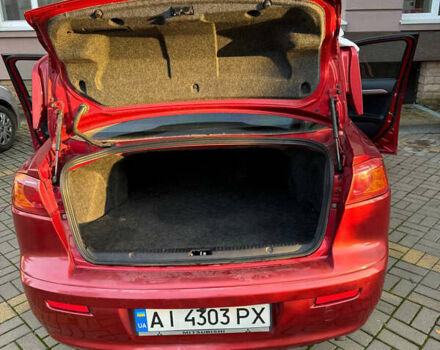 Красный Мицубиси Лансер, объемом двигателя 2 л и пробегом 143 тыс. км за 5200 $, фото 4 на Automoto.ua