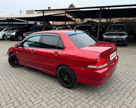 Красный Мицубиси Лансер, объемом двигателя 1.6 л и пробегом 215 тыс. км за 4500 $, фото 6 на Automoto.ua