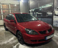 Красный Мицубиси Лансер, объемом двигателя 1.6 л и пробегом 204 тыс. км за 5299 $, фото 1 на Automoto.ua