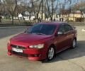 Красный Мицубиси Лансер, объемом двигателя 2 л и пробегом 244 тыс. км за 5999 $, фото 1 на Automoto.ua
