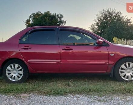 Красный Мицубиси Лансер, объемом двигателя 1.58 л и пробегом 198 тыс. км за 4650 $, фото 3 на Automoto.ua