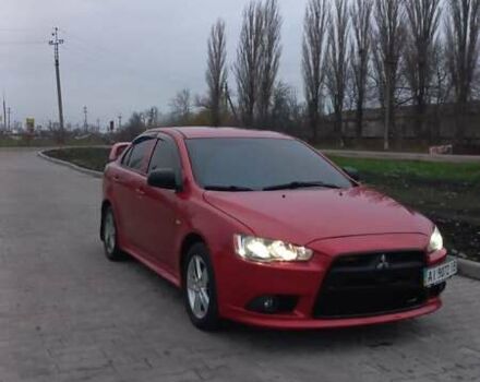 Красный Мицубиси Лансер, объемом двигателя 2 л и пробегом 200 тыс. км за 6000 $, фото 1 на Automoto.ua