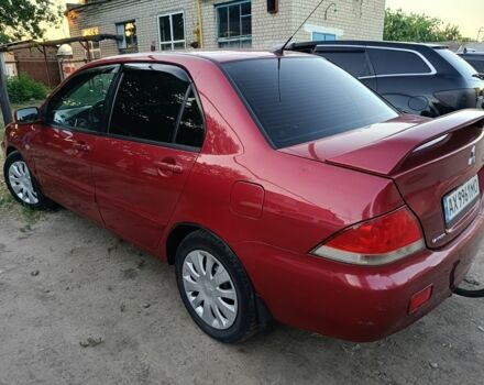 Червоний Міцубісі Lancer, об'ємом двигуна 1.6 л та пробігом 227 тис. км за 5300 $, фото 4 на Automoto.ua