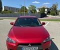 Червоний Міцубісі Lancer, об'ємом двигуна 2 л та пробігом 201 тис. км за 6500 $, фото 1 на Automoto.ua