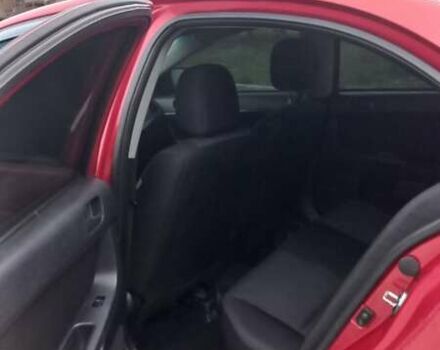 Красный Мицубиси Лансер, объемом двигателя 2 л и пробегом 200 тыс. км за 6000 $, фото 6 на Automoto.ua