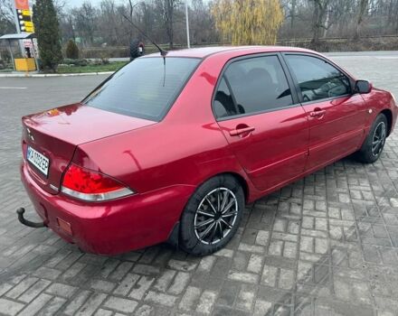 Красный Мицубиси Лансер, объемом двигателя 1.6 л и пробегом 265 тыс. км за 2956 $, фото 1 на Automoto.ua