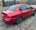 Красный Мицубиси Лансер, объемом двигателя 1.6 л и пробегом 265 тыс. км за 2956 $, фото 1 на Automoto.ua