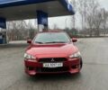 Красный Мицубиси Лансер, объемом двигателя 2 л и пробегом 223 тыс. км за 5800 $, фото 1 на Automoto.ua