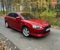 Красный Мицубиси Лансер, объемом двигателя 2 л и пробегом 197 тыс. км за 6500 $, фото 9 на Automoto.ua