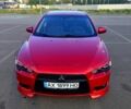Красный Мицубиси Лансер, объемом двигателя 2 л и пробегом 185 тыс. км за 7500 $, фото 1 на Automoto.ua
