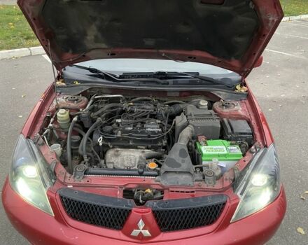 Червоний Міцубісі Lancer, об'ємом двигуна 1.6 л та пробігом 385 тис. км за 4500 $, фото 7 на Automoto.ua