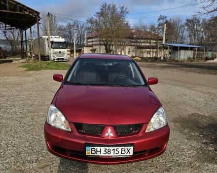 Червоний Міцубісі Lancer, об'ємом двигуна 1.6 л та пробігом 220 тис. км за 5800 $, фото 1 на Automoto.ua