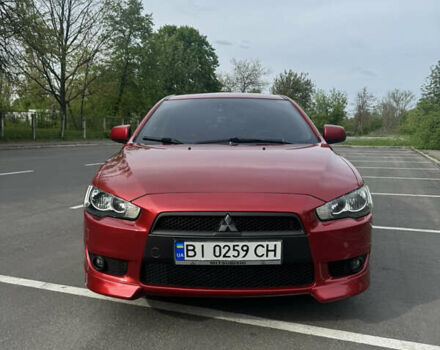 Червоний Міцубісі Lancer, об'ємом двигуна 2 л та пробігом 188 тис. км за 7390 $, фото 2 на Automoto.ua