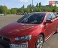 Красный Мицубиси Лансер, объемом двигателя 2 л и пробегом 312 тыс. км за 4300 $, фото 1 на Automoto.ua