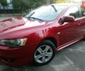Червоний Міцубісі Lancer, об'ємом двигуна 2 л та пробігом 249 тис. км за 5990 $, фото 1 на Automoto.ua