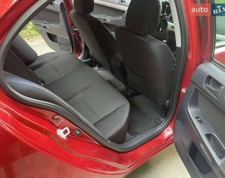 Красный Мицубиси Лансер, объемом двигателя 1.5 л и пробегом 124 тыс. км за 7100 $, фото 6 на Automoto.ua