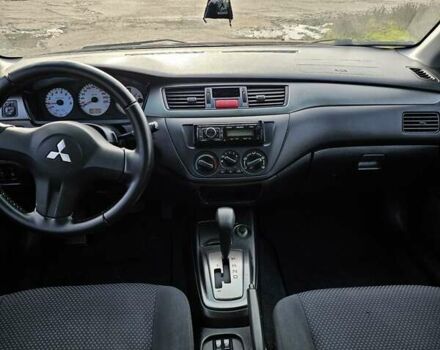 Червоний Міцубісі Lancer, об'ємом двигуна 1.6 л та пробігом 220 тис. км за 5800 $, фото 9 на Automoto.ua