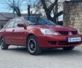 Красный Мицубиси Лансер, объемом двигателя 16 л и пробегом 159 тыс. км за 6000 $, фото 1 на Automoto.ua