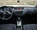 Червоний Міцубісі Lancer, об'ємом двигуна 1.6 л та пробігом 220 тис. км за 5800 $, фото 9 на Automoto.ua