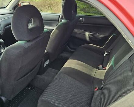 Червоний Міцубісі Lancer, об'ємом двигуна 1.6 л та пробігом 220 тис. км за 5800 $, фото 13 на Automoto.ua