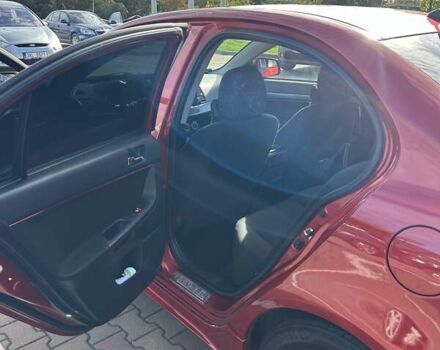 Красный Мицубиси Лансер, объемом двигателя 2 л и пробегом 227 тыс. км за 7000 $, фото 11 на Automoto.ua