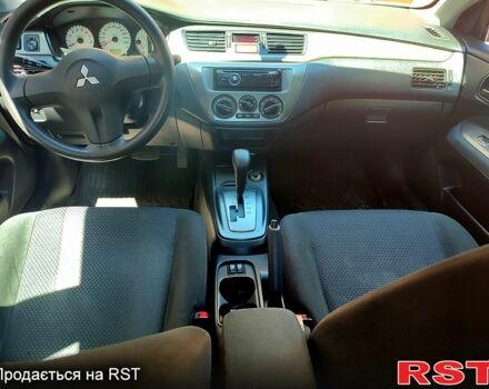 Красный Мицубиси Лансер, объемом двигателя 1.6 л и пробегом 140 тыс. км за 5500 $, фото 6 на Automoto.ua