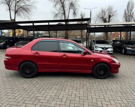 Красный Мицубиси Лансер, объемом двигателя 1.6 л и пробегом 215 тыс. км за 4500 $, фото 10 на Automoto.ua