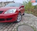 Красный Мицубиси Лансер, объемом двигателя 1.58 л и пробегом 275 тыс. км за 5000 $, фото 1 на Automoto.ua