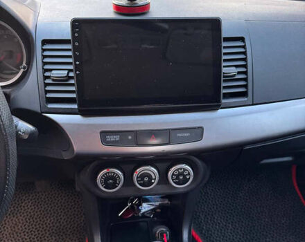 Красный Мицубиси Лансер, объемом двигателя 2 л и пробегом 143 тыс. км за 5200 $, фото 17 на Automoto.ua