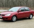 Червоний Міцубісі Lancer, об'ємом двигуна 1.6 л та пробігом 220 тис. км за 4600 $, фото 3 на Automoto.ua
