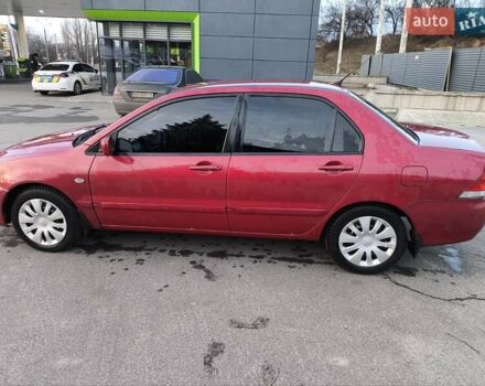 Червоний Міцубісі Lancer, об'ємом двигуна 1.58 л та пробігом 140 тис. км за 6000 $, фото 9 на Automoto.ua