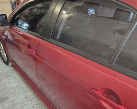 Красный Мицубиси Лансер, объемом двигателя 2 л и пробегом 65 тыс. км за 9300 $, фото 1 на Automoto.ua