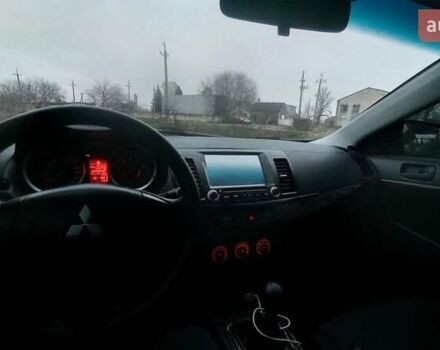 Красный Мицубиси Лансер, объемом двигателя 2 л и пробегом 200 тыс. км за 6000 $, фото 8 на Automoto.ua