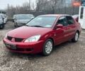 Красный Мицубиси Лансер, объемом двигателя 1.6 л и пробегом 222 тыс. км за 5700 $, фото 1 на Automoto.ua