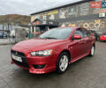 Червоний Міцубісі Lancer, об'ємом двигуна 2 л та пробігом 150 тис. км за 7000 $, фото 1 на Automoto.ua