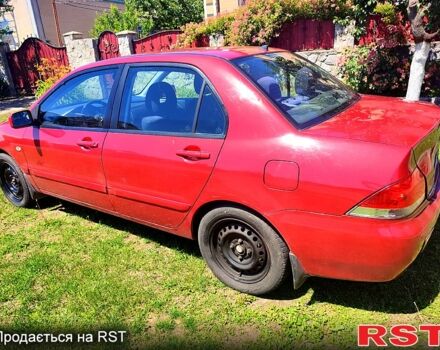 Красный Мицубиси Лансер, объемом двигателя 1.6 л и пробегом 140 тыс. км за 5500 $, фото 5 на Automoto.ua