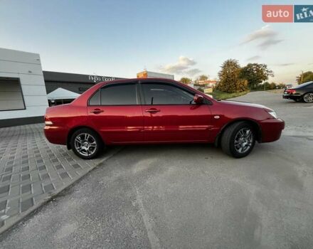 Червоний Міцубісі Lancer, об'ємом двигуна 1.6 л та пробігом 257 тис. км за 4600 $, фото 3 на Automoto.ua