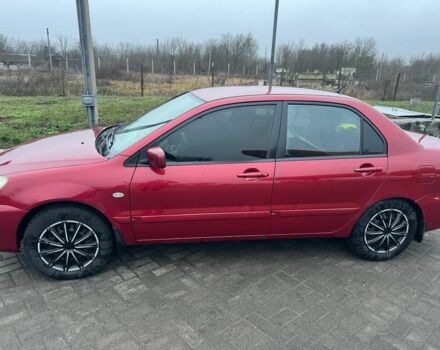 Красный Мицубиси Лансер, объемом двигателя 1.6 л и пробегом 265 тыс. км за 2956 $, фото 2 на Automoto.ua