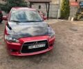 Красный Мицубиси Лансер, объемом двигателя 2 л и пробегом 340 тыс. км за 7500 $, фото 1 на Automoto.ua