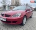 Красный Мицубиси Лансер, объемом двигателя 1.3 л и пробегом 222 тыс. км за 3700 $, фото 1 на Automoto.ua